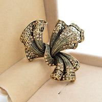 broche-en-alliage-darc-vintage