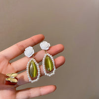 boucles-doreilles-oeil-de-chat-vert-vintage