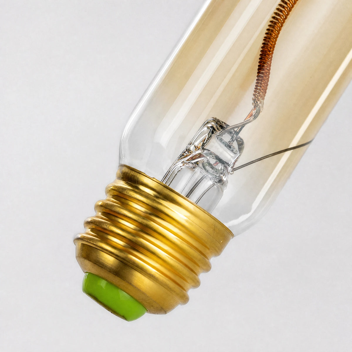 Ampoule vintage tubulaire à filament décoratif spirale - close-up détail matière