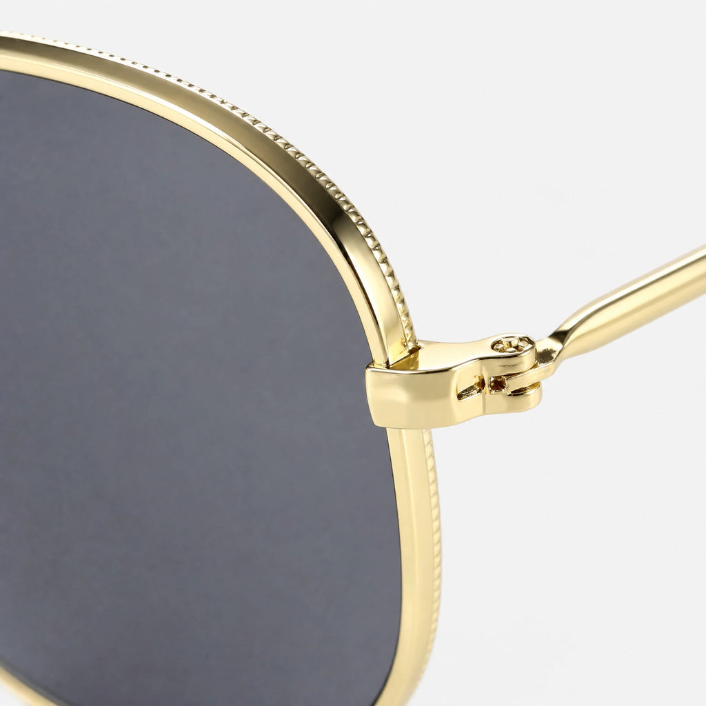 Lunettes de Soleil Rétro Hexagonales Dorées - close-up détail matière