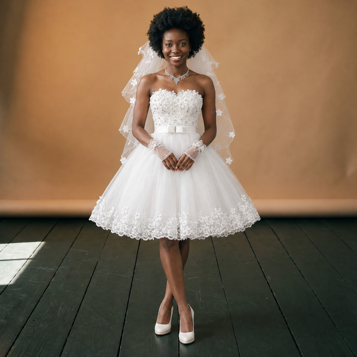 Robe de mariée vintage pin-up courte portée en studio, jupe en tulle évasée, vue de face Image